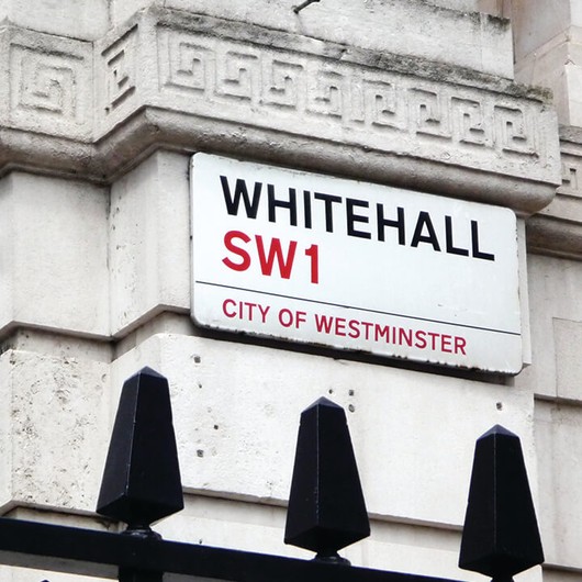 Shot of a building with street sign for Whitehall, SW1, City of Westminster